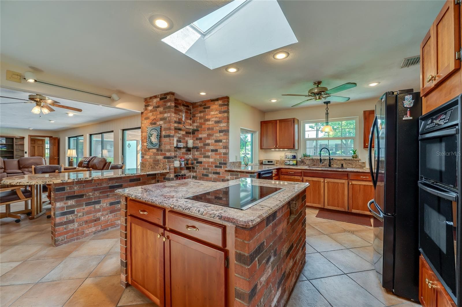 Kitchen island with cooktop - 697 JOHN ANDERSON DR, ORMOND BEACH