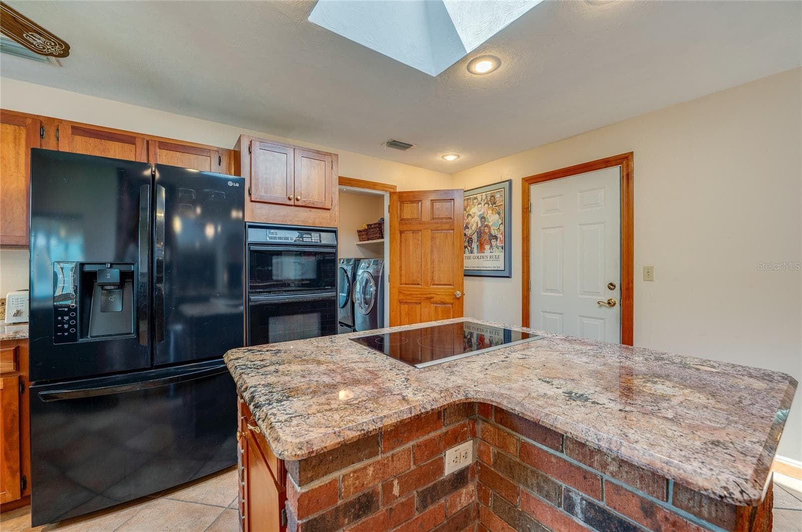 Kitchen island with cooktop - 697 JOHN ANDERSON DR, ORMOND BEACH