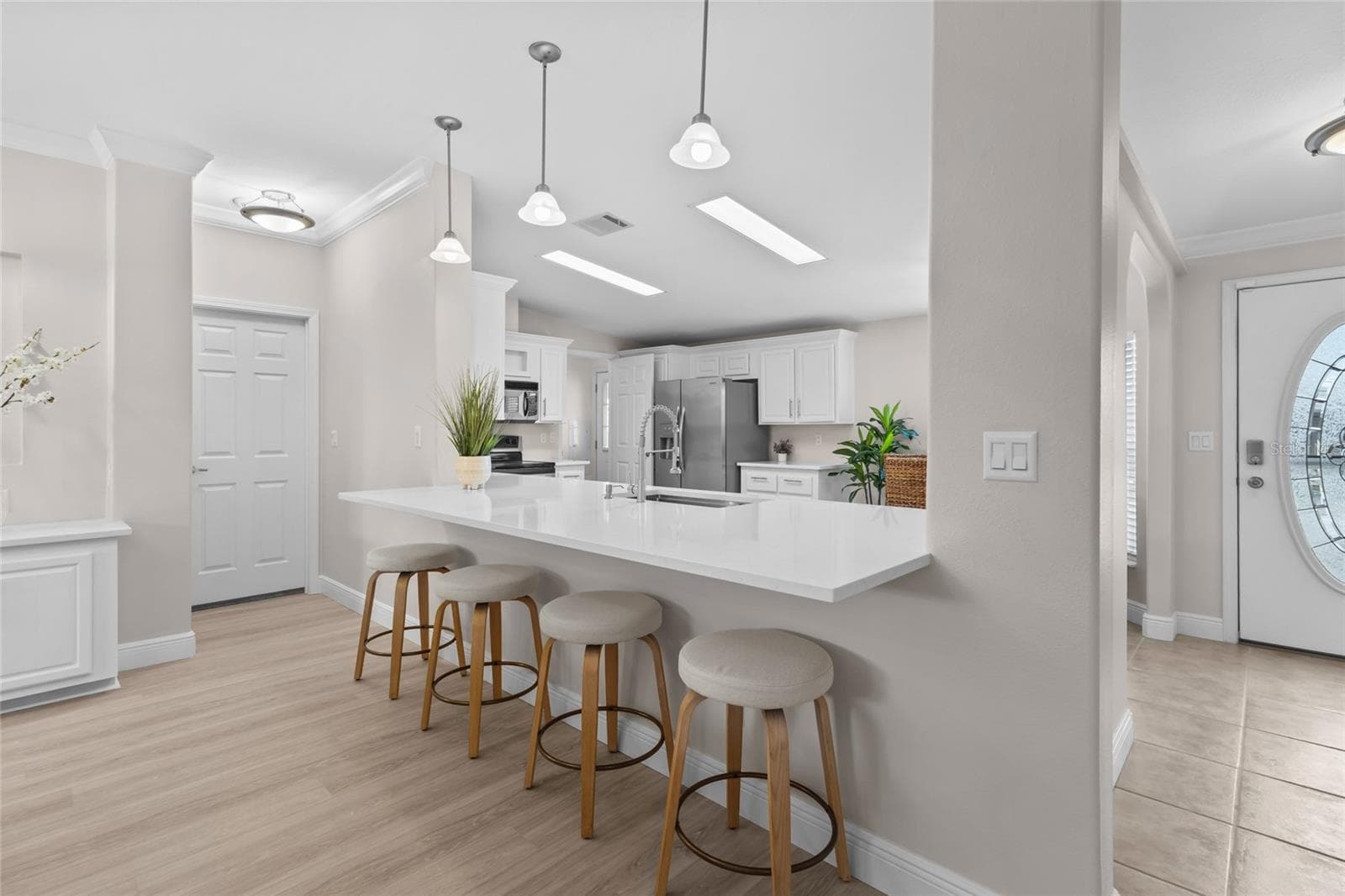 UPDATED QUARTZ COUNTER TOPS AND ADDED COUNTER HEIGHT SEATING - 1710 INDIANA AVE, BRADENTON