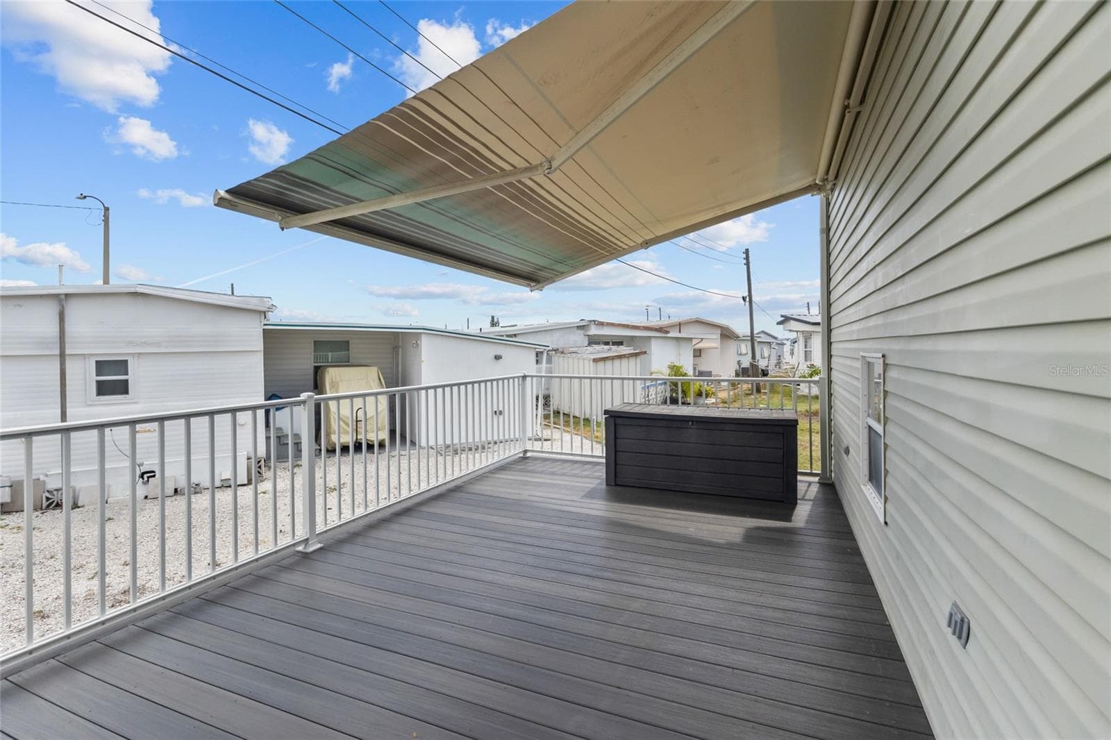 BACK DECK WITH RETRACTABLE SUNSHADE - 1710 INDIANA AVE, BRADENTON