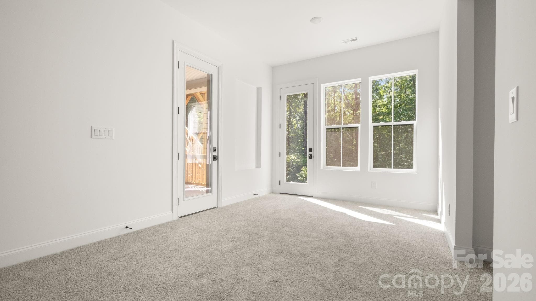 Living space leading to deck - 6774 Kingfisher Court, Denver
