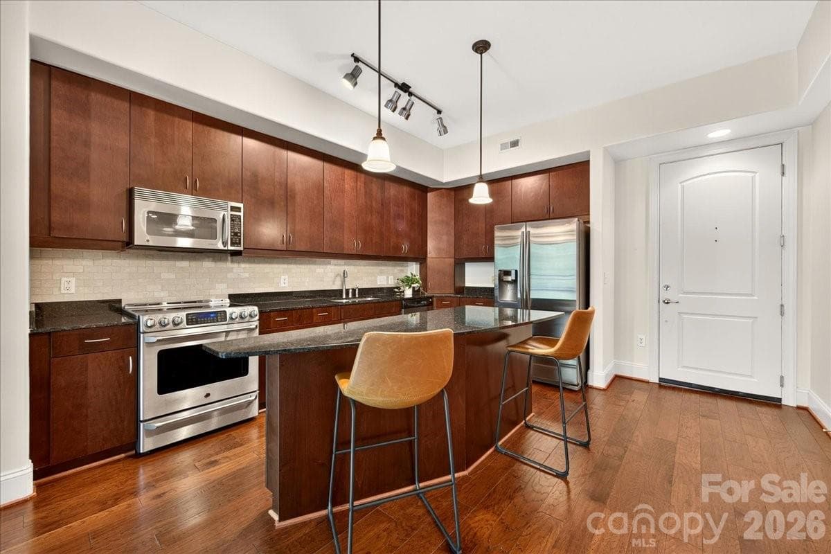 Sleek kitchen with tons of cabinet storage - Charlotte