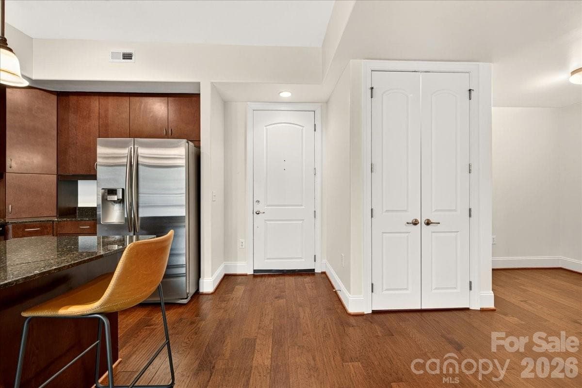 View of the front door, laundry closet, and office/flex - Charlotte