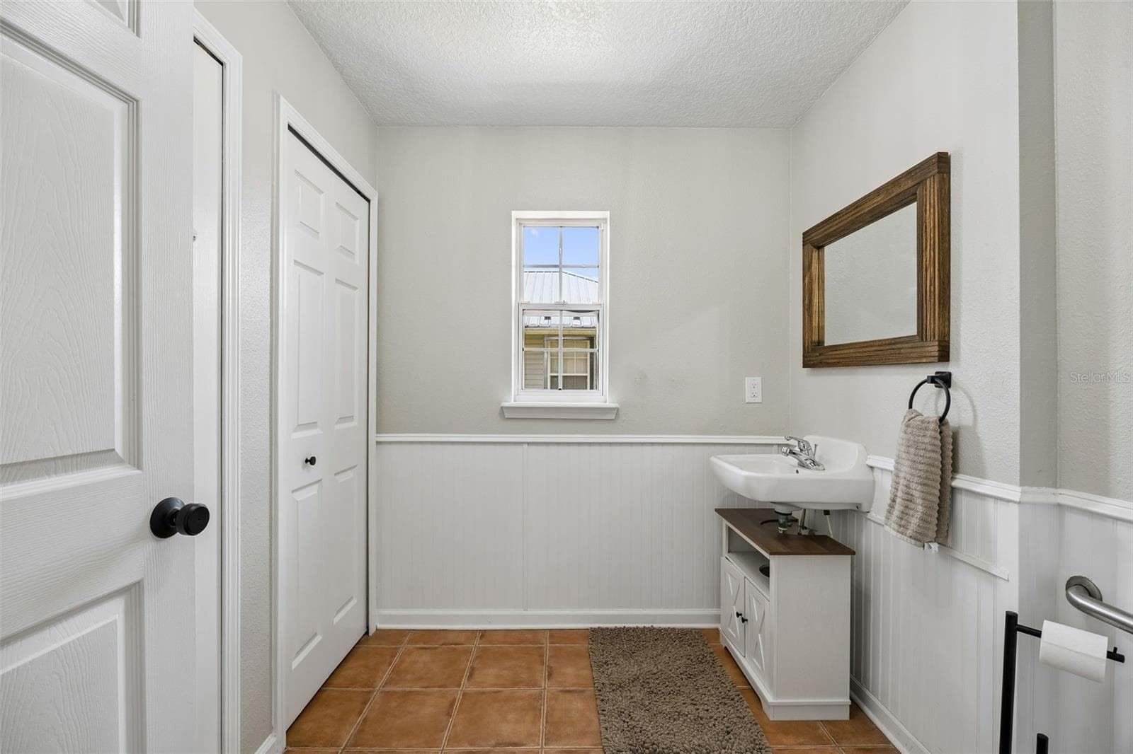 And off the kitchen a convenient half bath - 134 BOWFIN DR, PALATKA