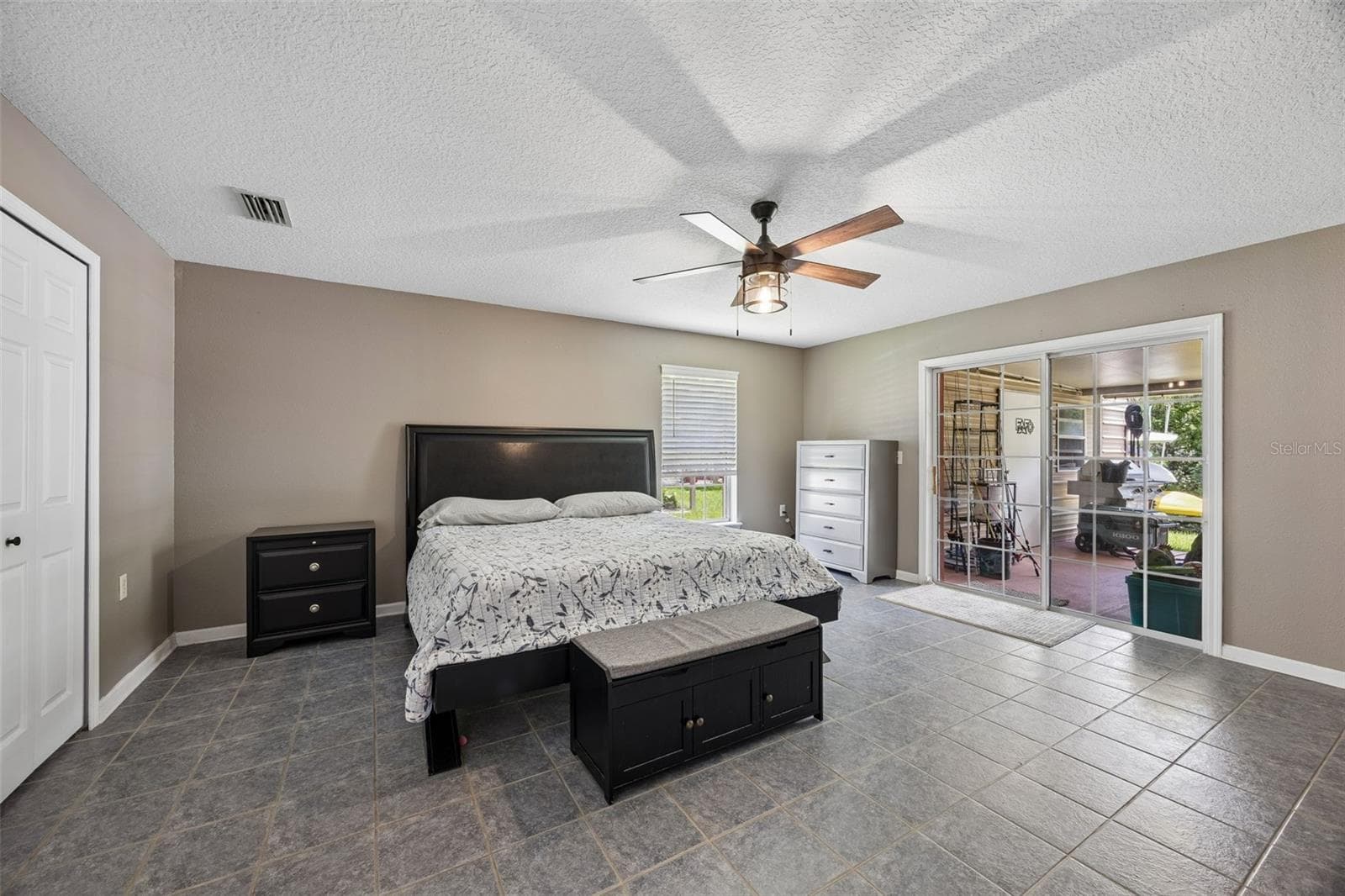 The huge primary bedroom overlooks the canal - 134 BOWFIN DR, PALATKA