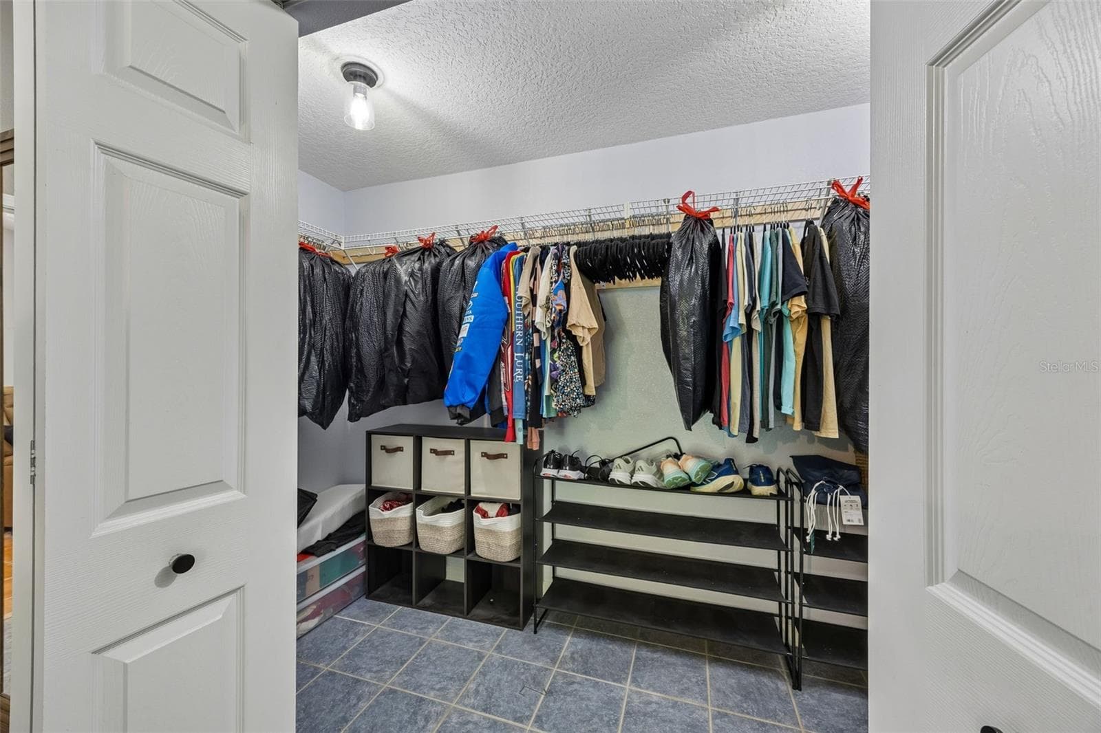 There is a 10'7" x 5'3" Walk-in primary closet - 134 BOWFIN DR, PALATKA