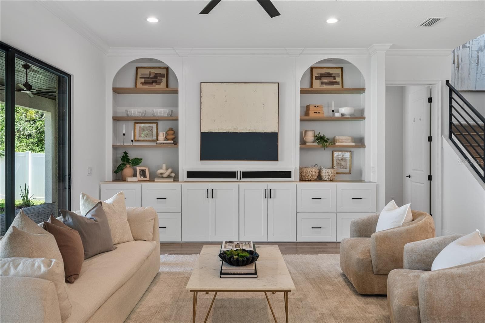 Built-in entertainment system with arch accents - 2403 DERBYSHIRE AVE, LAKELAND