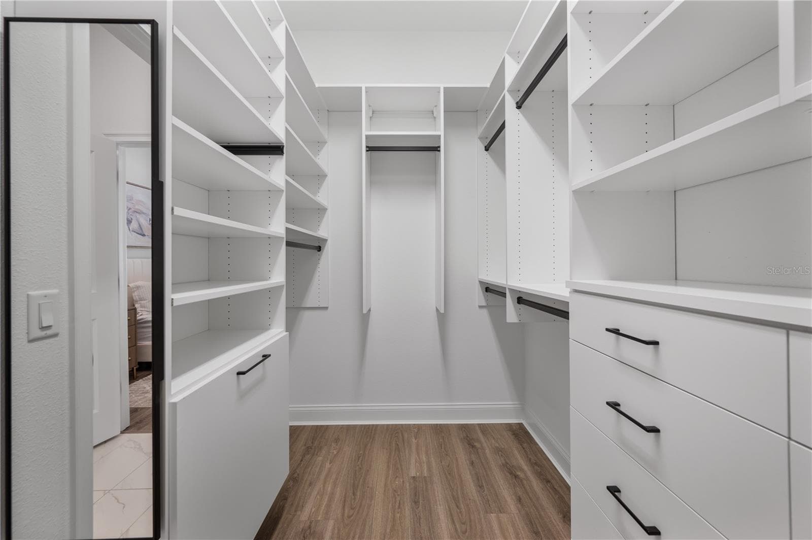 Walk-in closet with custom California Closets system - 2403 DERBYSHIRE AVE, LAKELAND