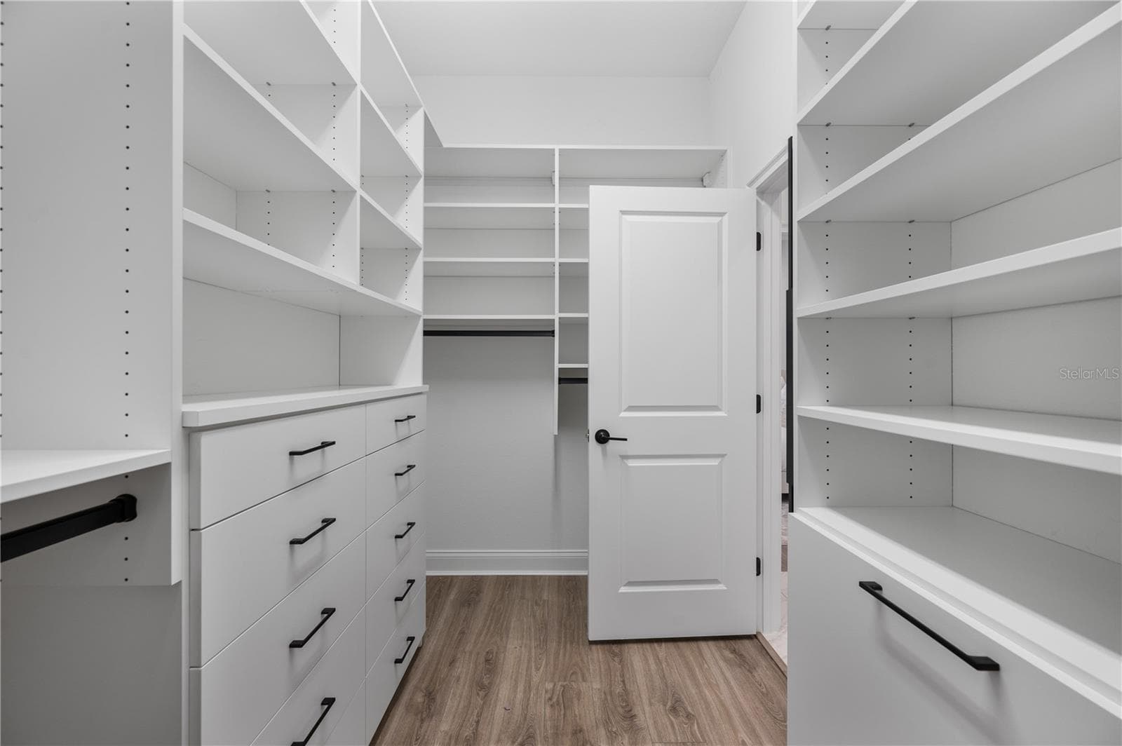 Walk-in closet with custom California Closets system - 2403 DERBYSHIRE AVE, LAKELAND