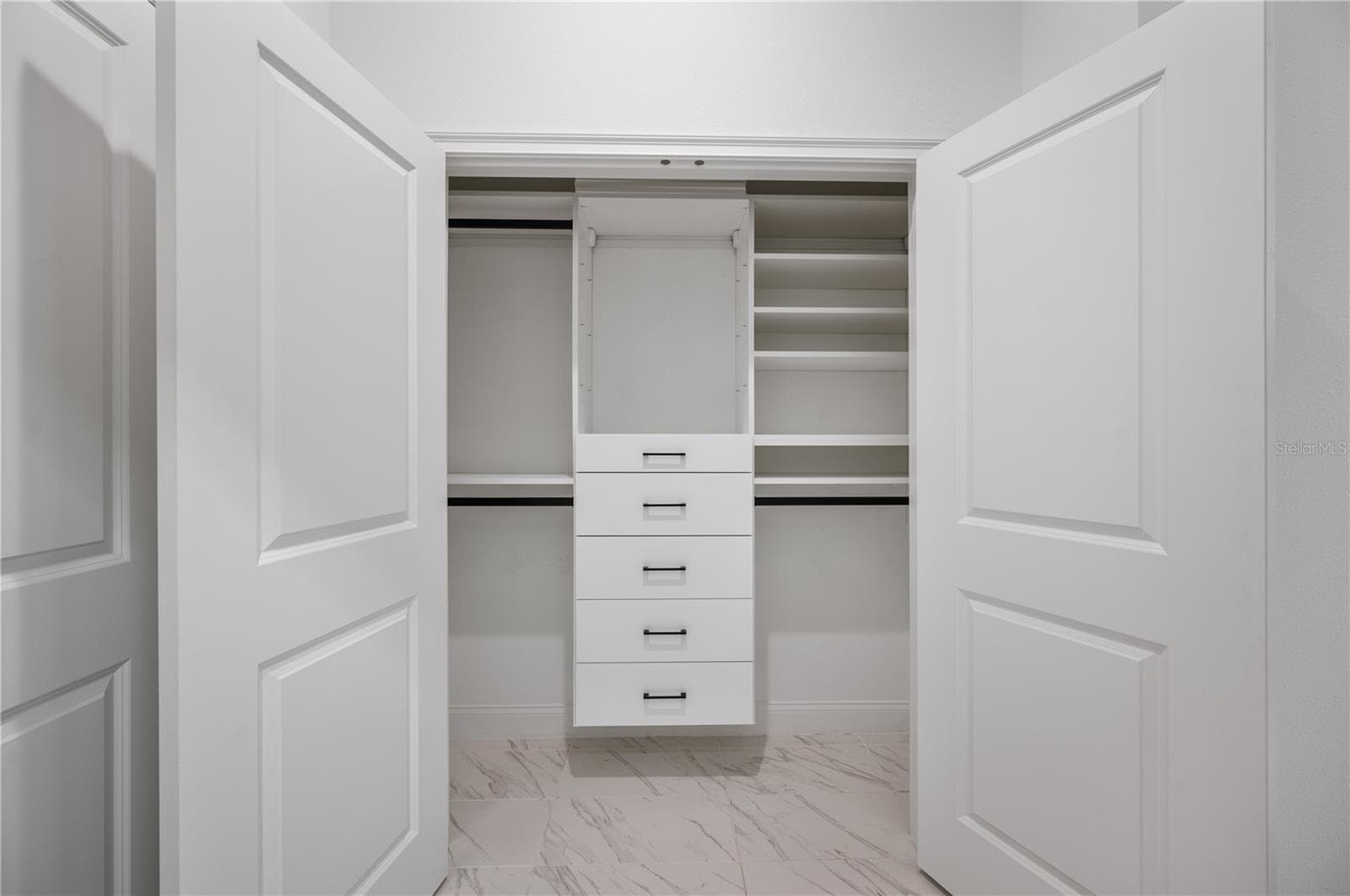Second primary closet with California Closets system - 2403 DERBYSHIRE AVE, LAKELAND