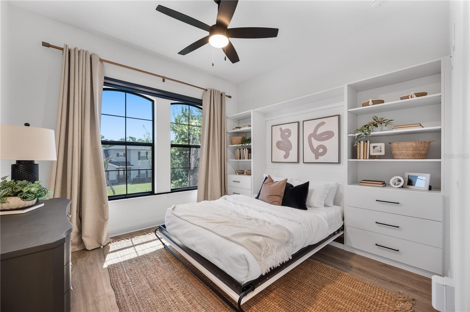 Custom built Murphy queen bed at front of home with built in storage system - 2403 DERBYSHIRE AVE, LAKELAND