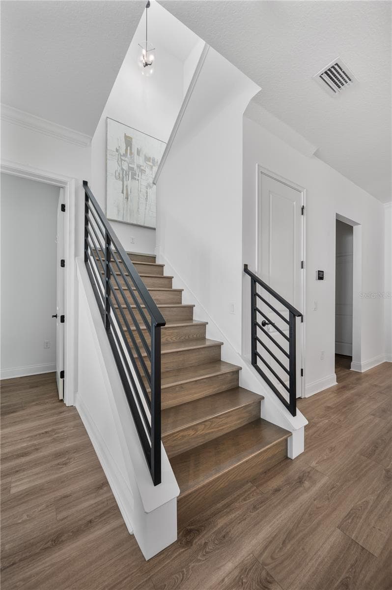Stairs to upstairs loft and bedrooms - 2403 DERBYSHIRE AVE, LAKELAND