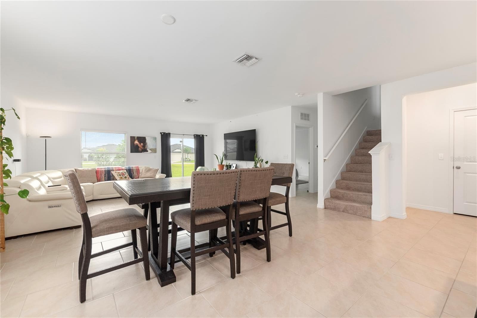 Bright dining space overlooking the backyard, perfect for everyday meals and entertaining guests. - 17177 MONTE ISOLA WAY, NORTH FORT MYERS