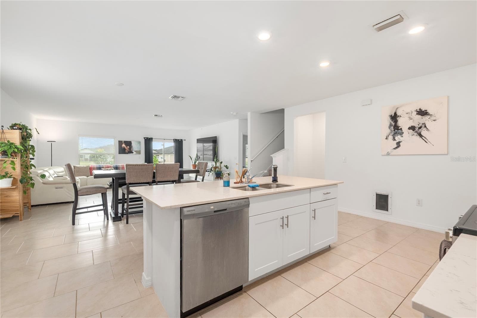 Gourmet kitchen with large center island, abundant cabinetry, and seamless flow into the living and dining areas. - 17177 MONTE ISOLA WAY, NORTH FORT MYERS