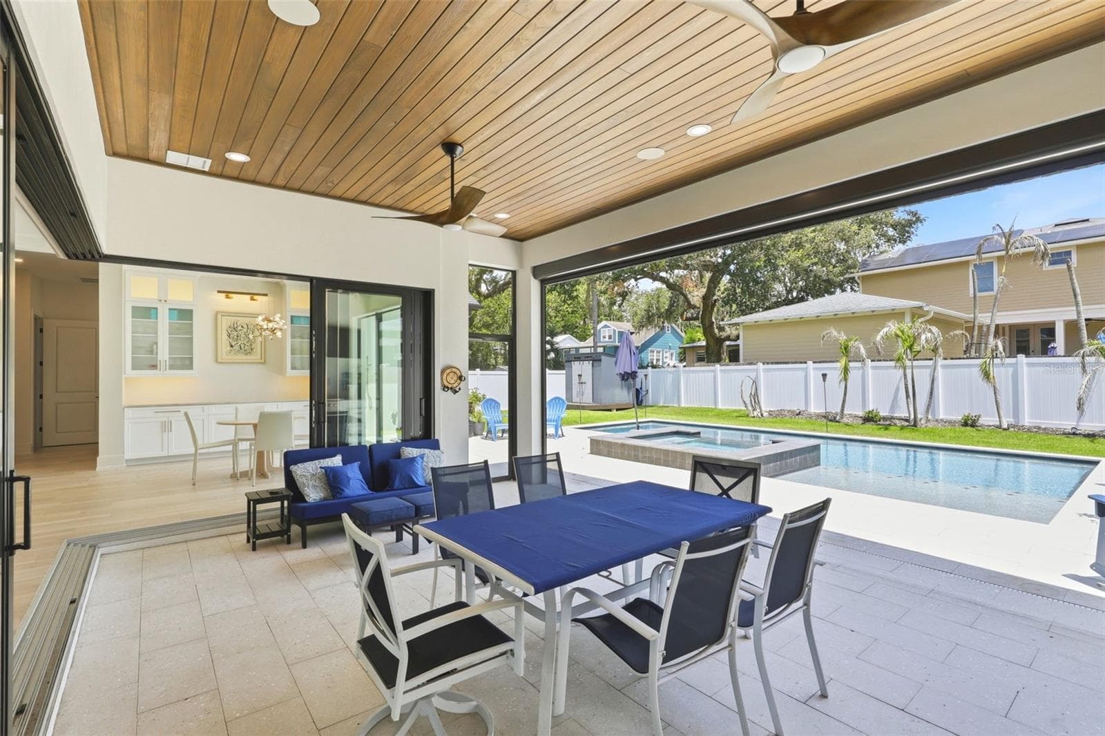 Lanai area with doors open to the living area and retractable screen open to the pool - 809 E CHURCH ST, ORLANDO