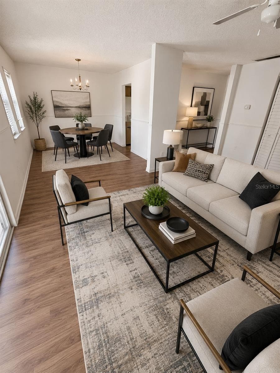 Staged living dining room - 10800 US HIGHWAY 19 N #237, PINELLAS PARK