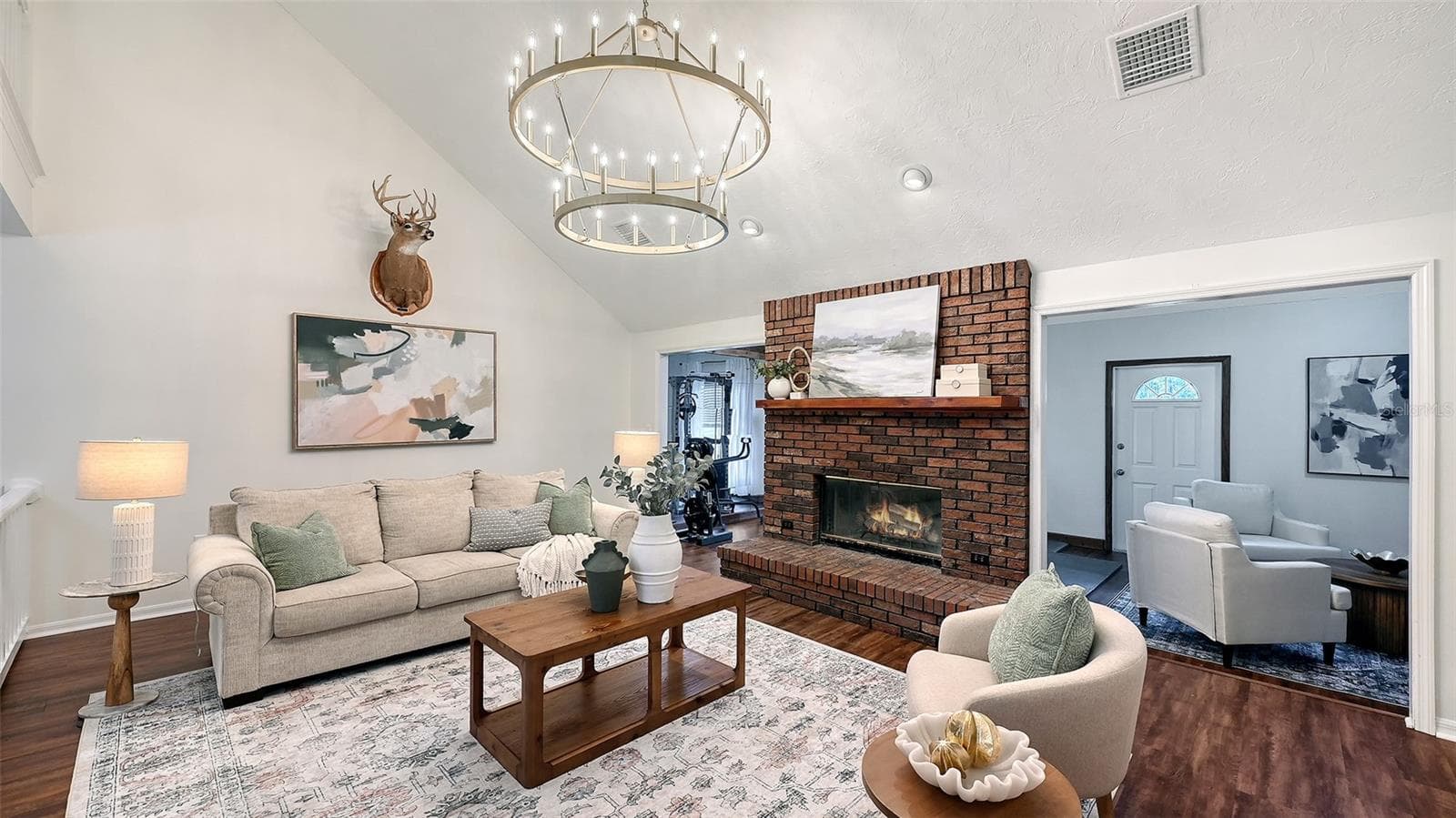 Living Room with Brick Exterior Wood Burning Fireplace - 28401 104TH DR E, MYAKKA CITY