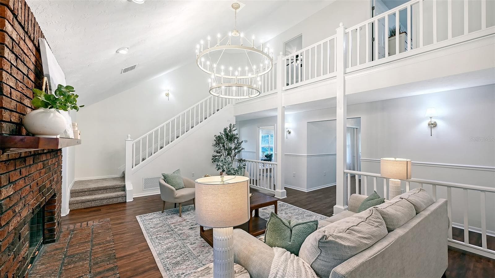 Living Room with Second Floor View of Stairs - 28401 104TH DR E, MYAKKA CITY