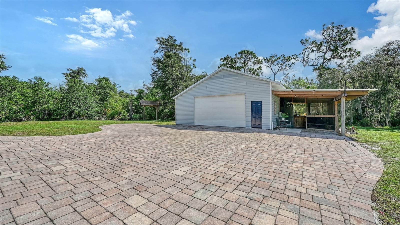 Detached Shop with multiple lean-tos and outdoor kitchen - 28401 104TH DR E, MYAKKA CITY