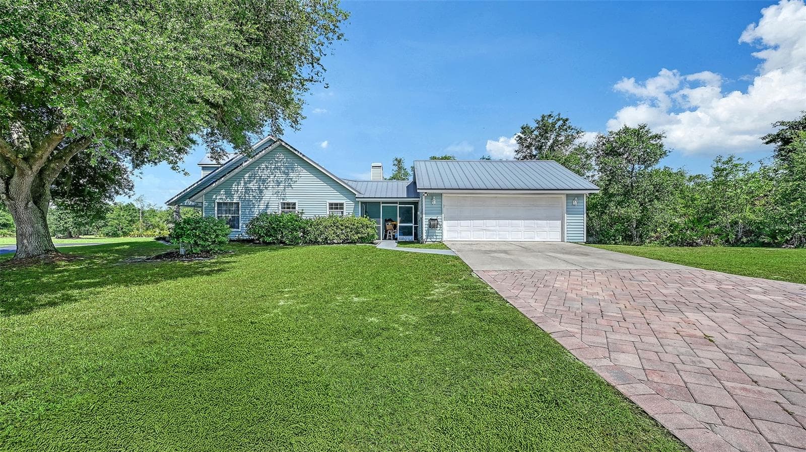 Exterior View with Attached Two Car Garage and Breezeway - 28401 104TH DR E, MYAKKA CITY