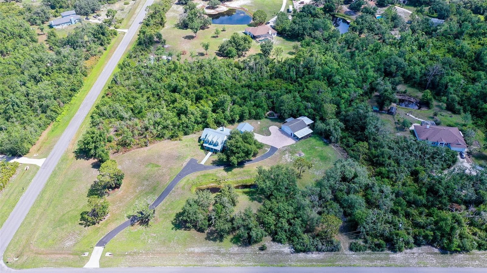 Aerial View of Property and Magnolia Hill Neighborhood - 28401 104TH DR E, MYAKKA CITY