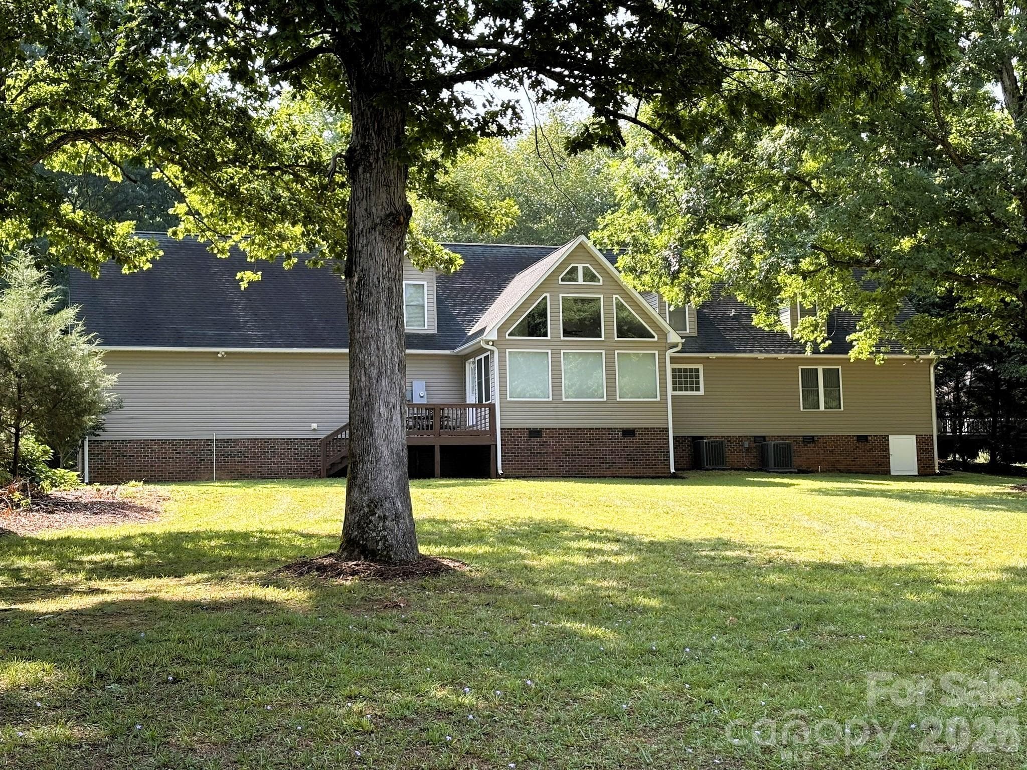 Back of the home, facing Lake Tillery - 130 Canoe Court, Mount Gilead