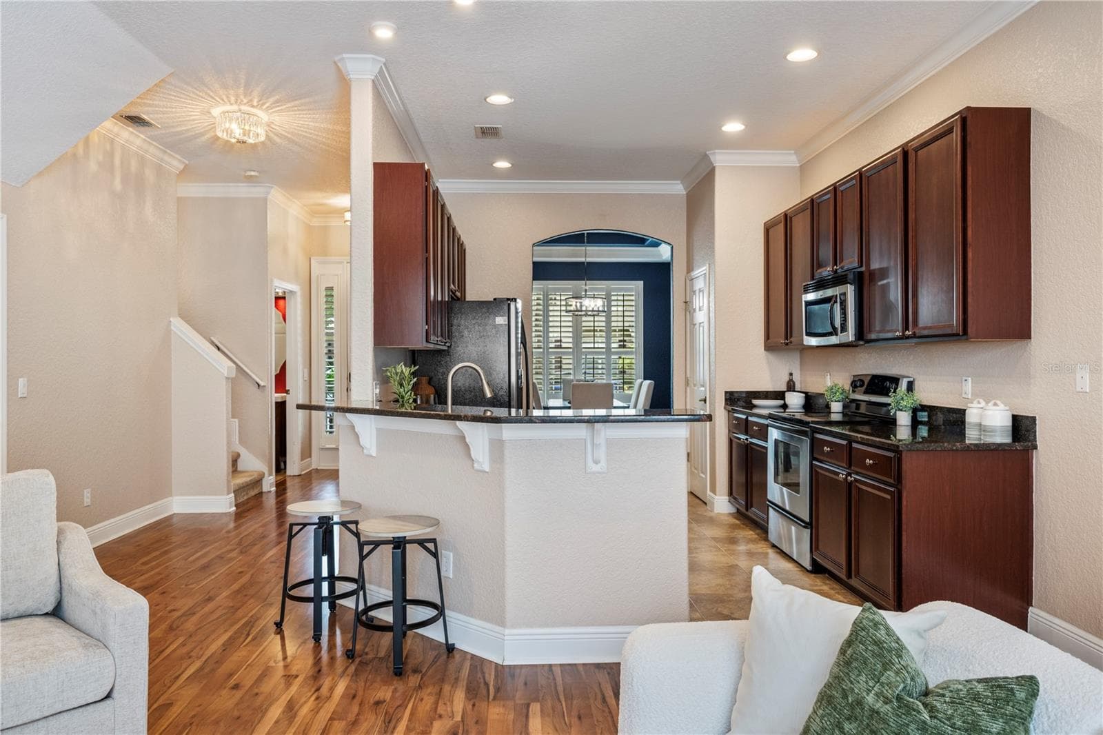 Laminate flooring throughout the living space - 573 SHINING ARMOR LN, LONGWOOD
