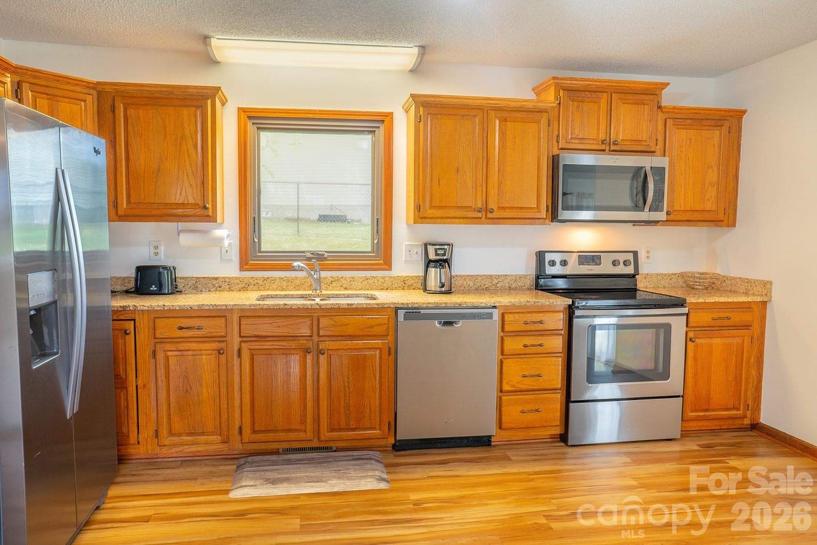 Open Kitchen with hardwood floors - 100 Forest Park Drive, Hendersonville
