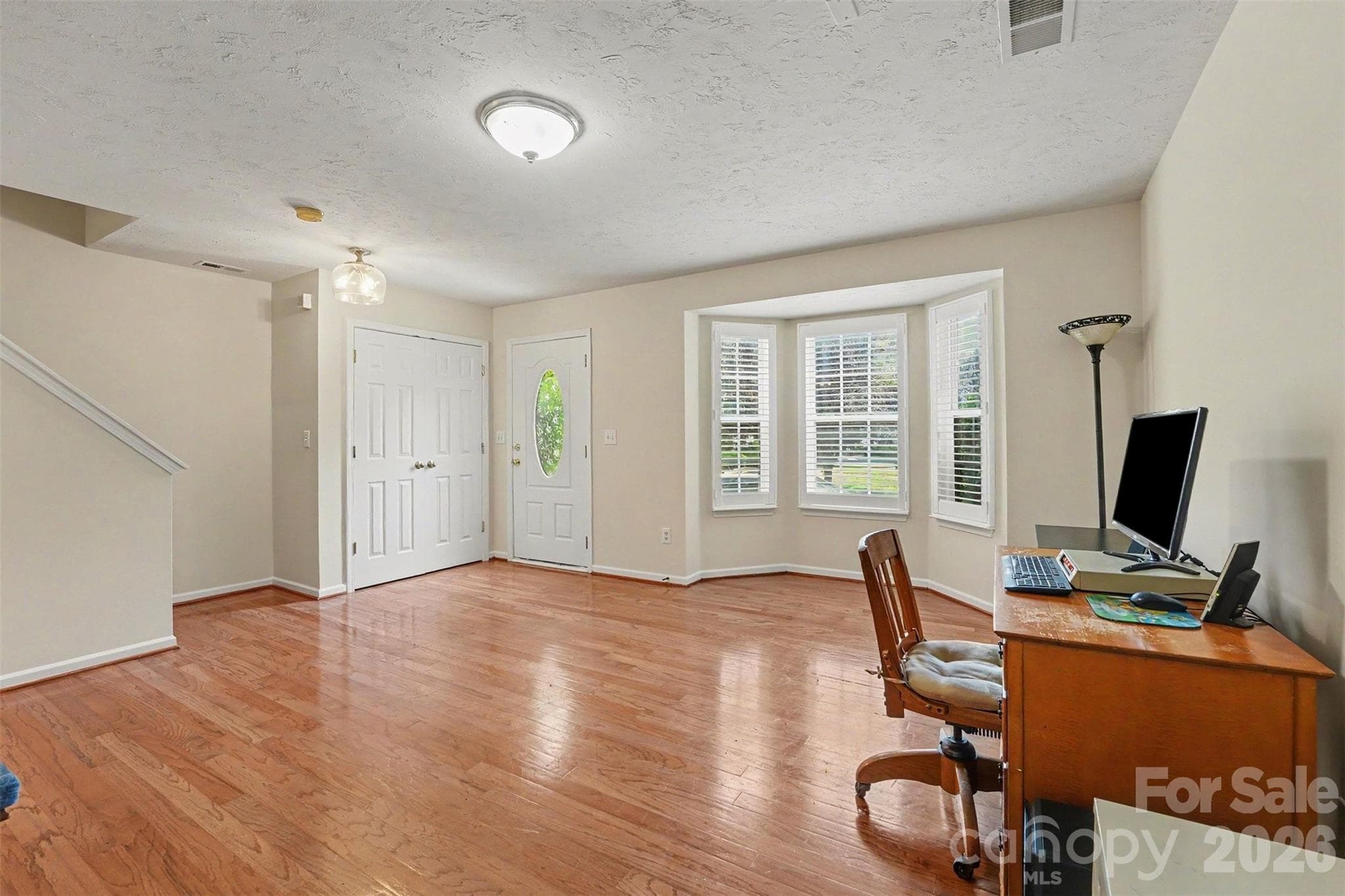 1st floor front door featuring formal living room or flex space - Matthews