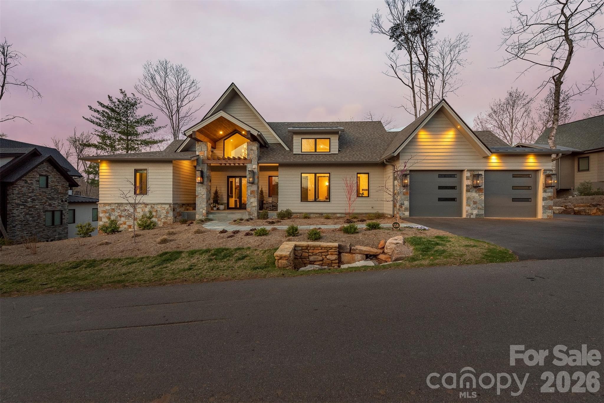 Gas lights on the exterior adds to the beauty of this home - Asheville