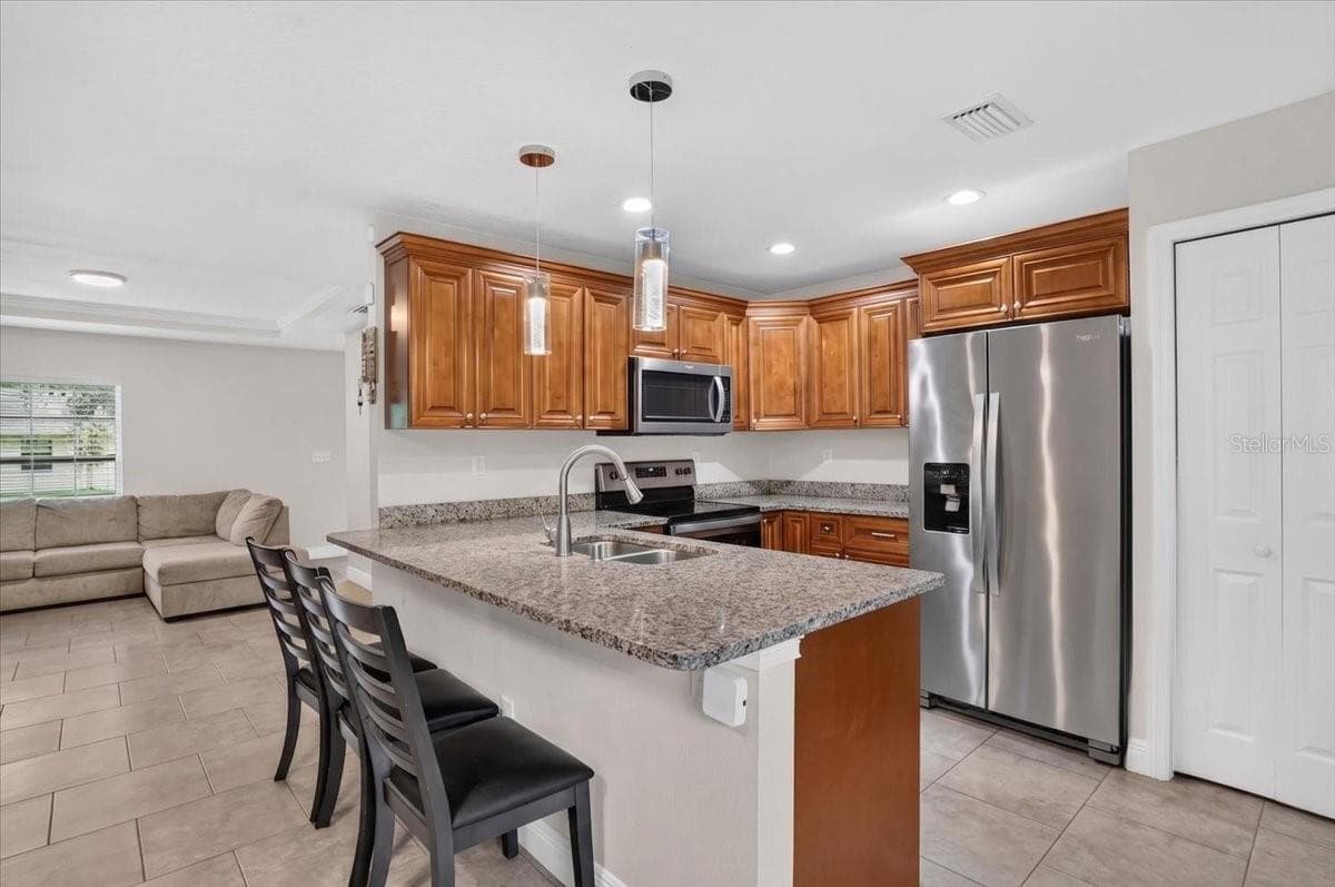 Single Family Residence at 1607 E LINEBAUGH AVE, TAMPA, photo 6 of 17