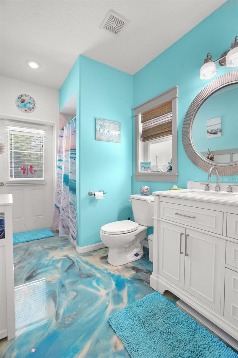 Gorgeous epoxy flooring in this pool bath!! - 2117 LARKSPUR CT, TRINITY