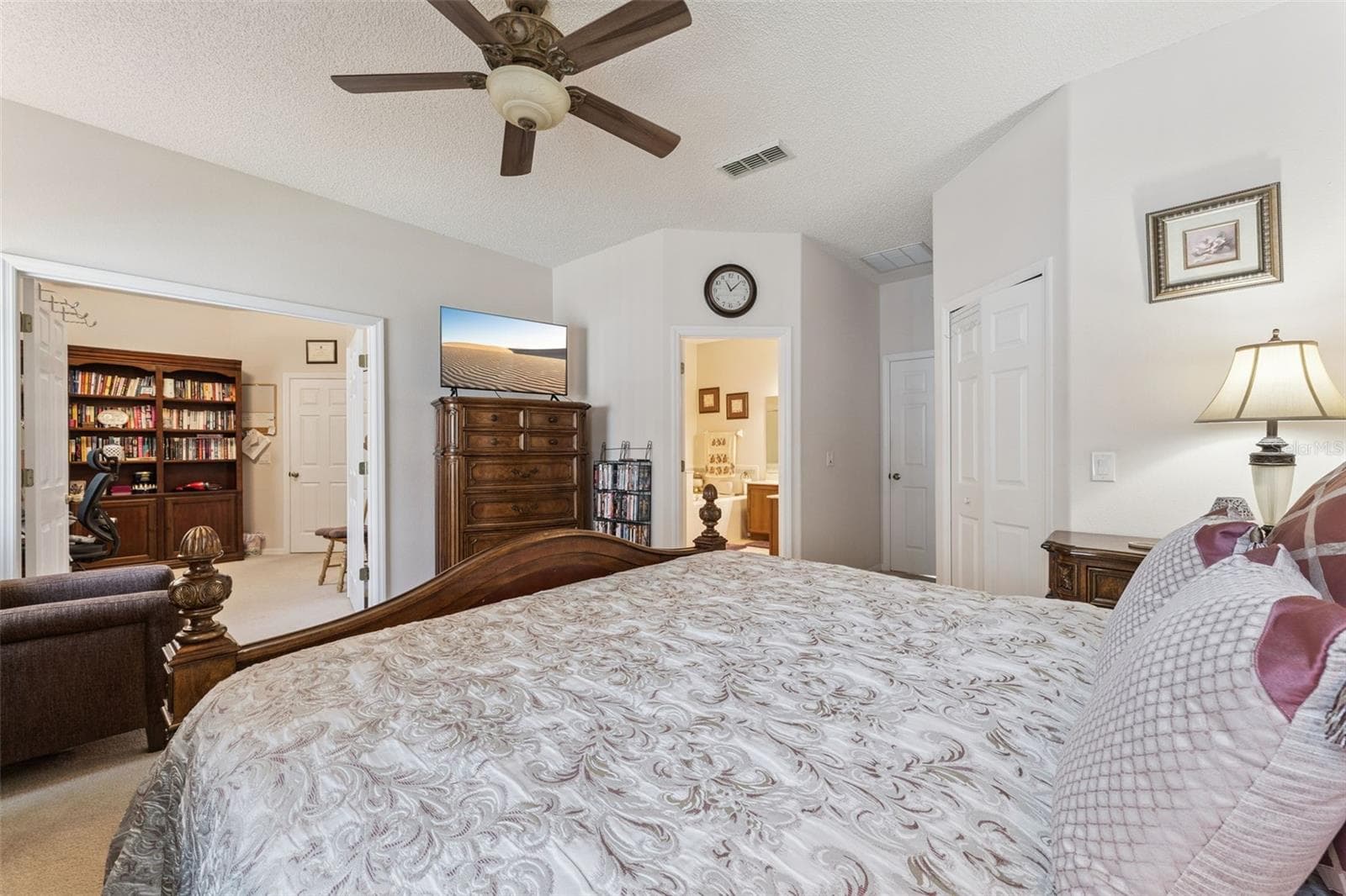 Primary Bedroom features double doors that open to the fourth bedroom which is currently used as a home oiffice - 9955 MEDALLION BLUFF LN, ORLANDO