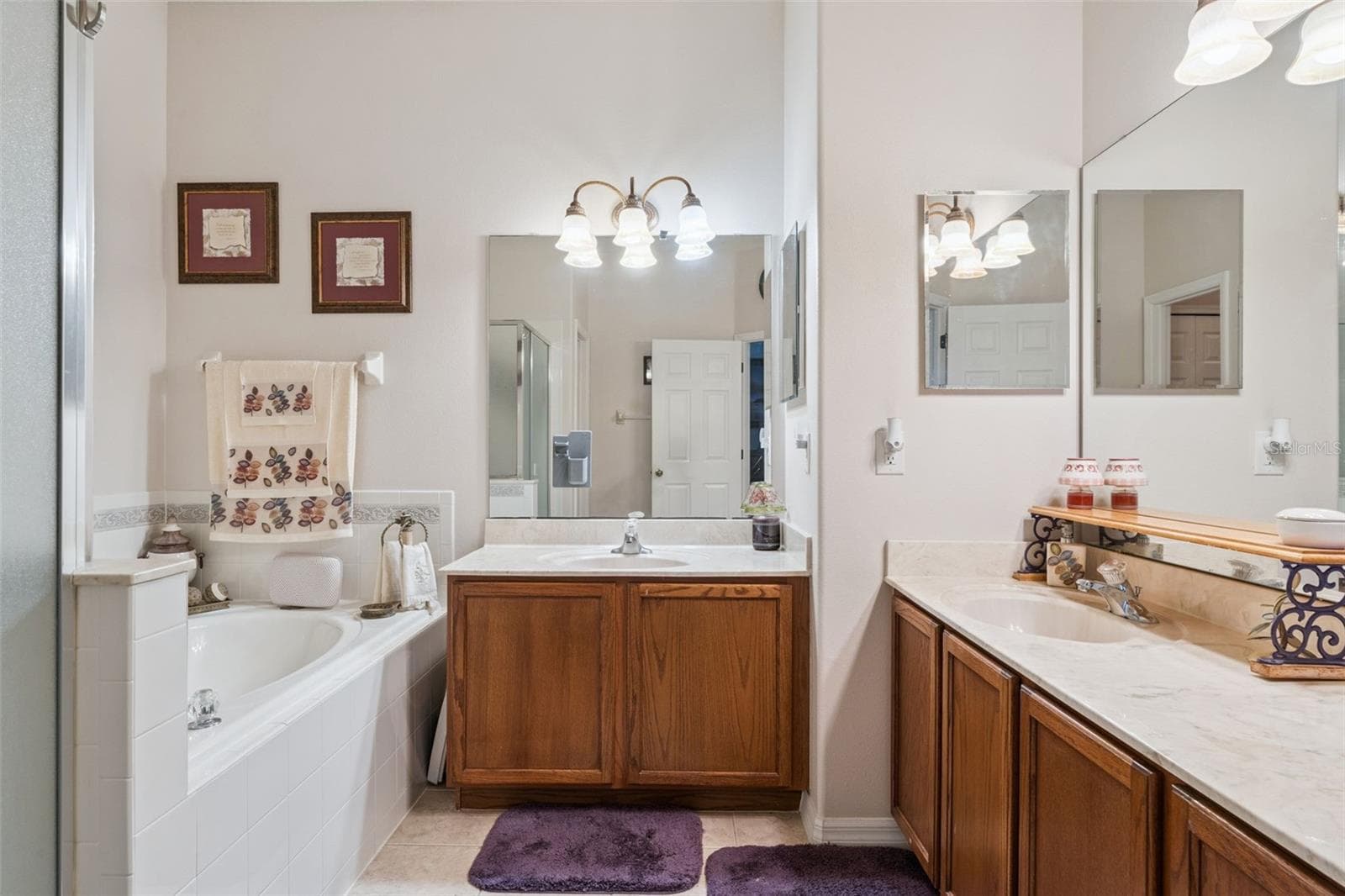 Primary Bathroom with separate sinks and generous counter space - 9955 MEDALLION BLUFF LN, ORLANDO