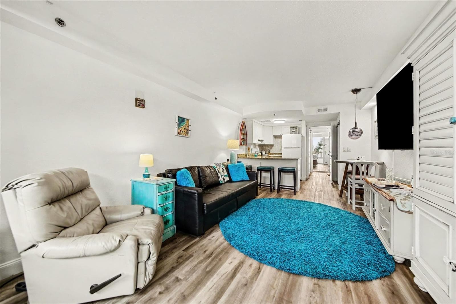 living room with convertible couch - 2700 N ATLANTIC AVE #214, DAYTONA BEACH