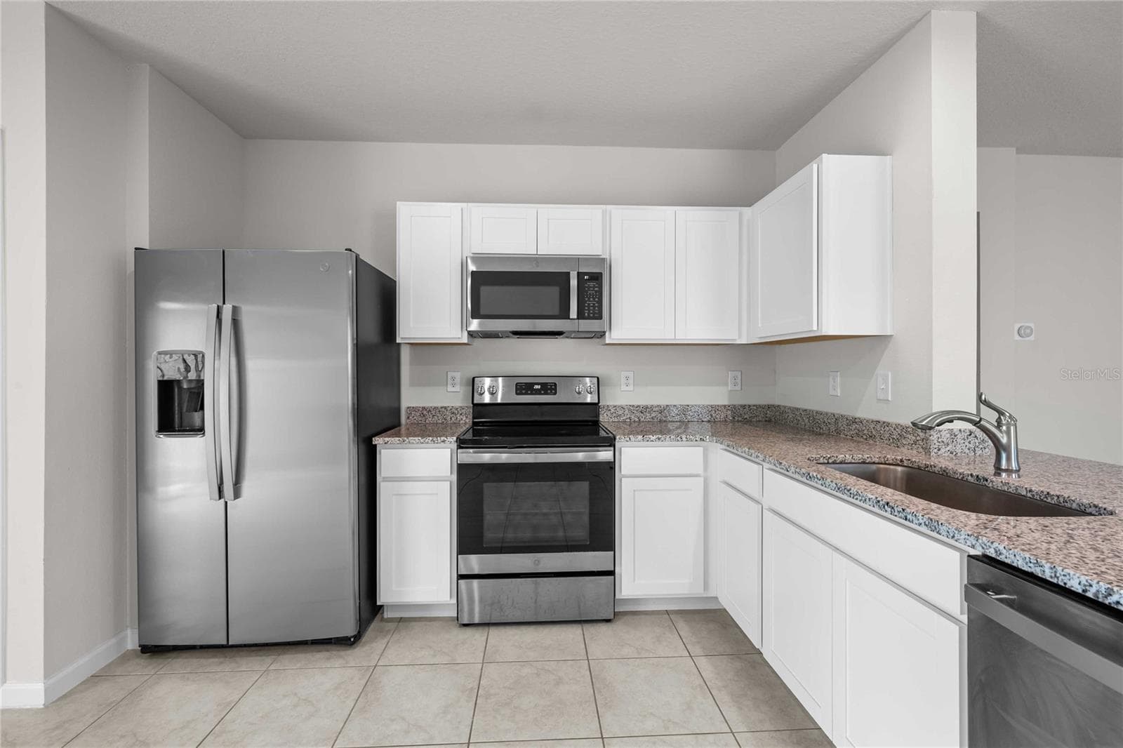 Stylish white mission style cabinets here. - 35155 JOMAR AVE, ZEPHYRHILLS