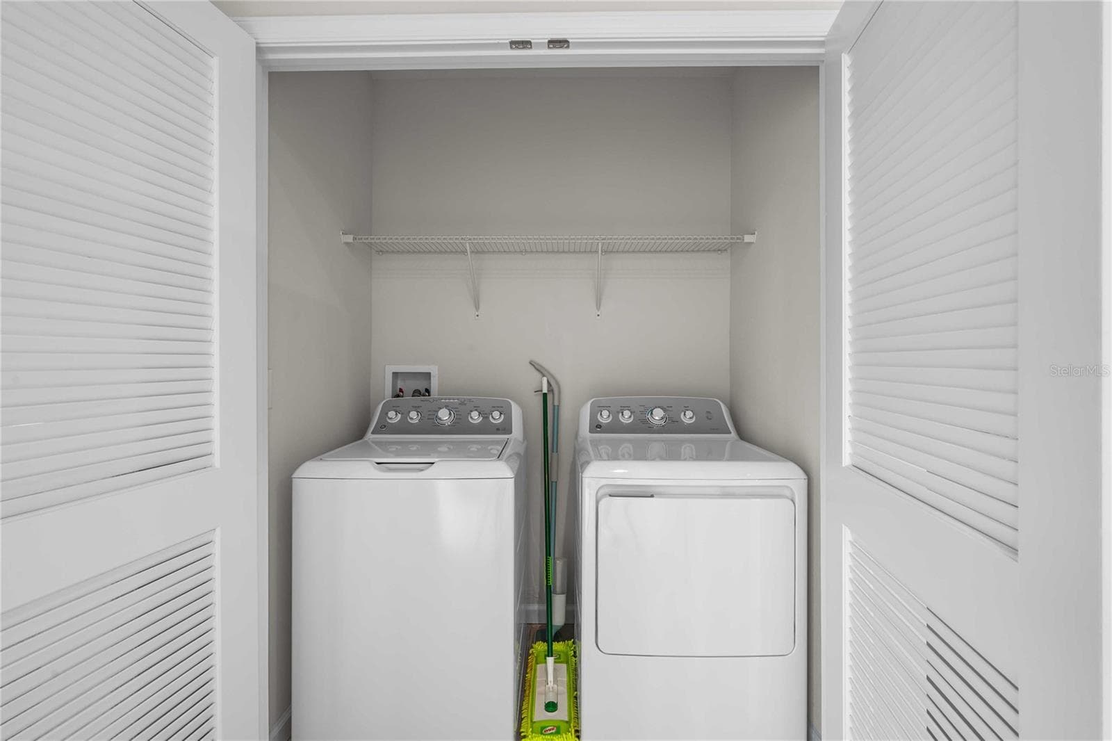 Laundry is in the kitchen - 35155 JOMAR AVE, ZEPHYRHILLS