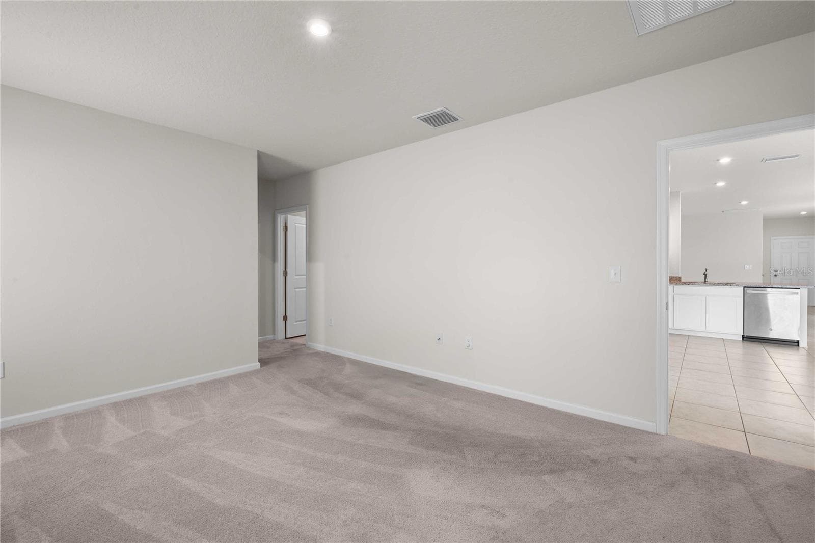 The primary bedroom is at the back off the home off the kitchen - 35155 JOMAR AVE, ZEPHYRHILLS