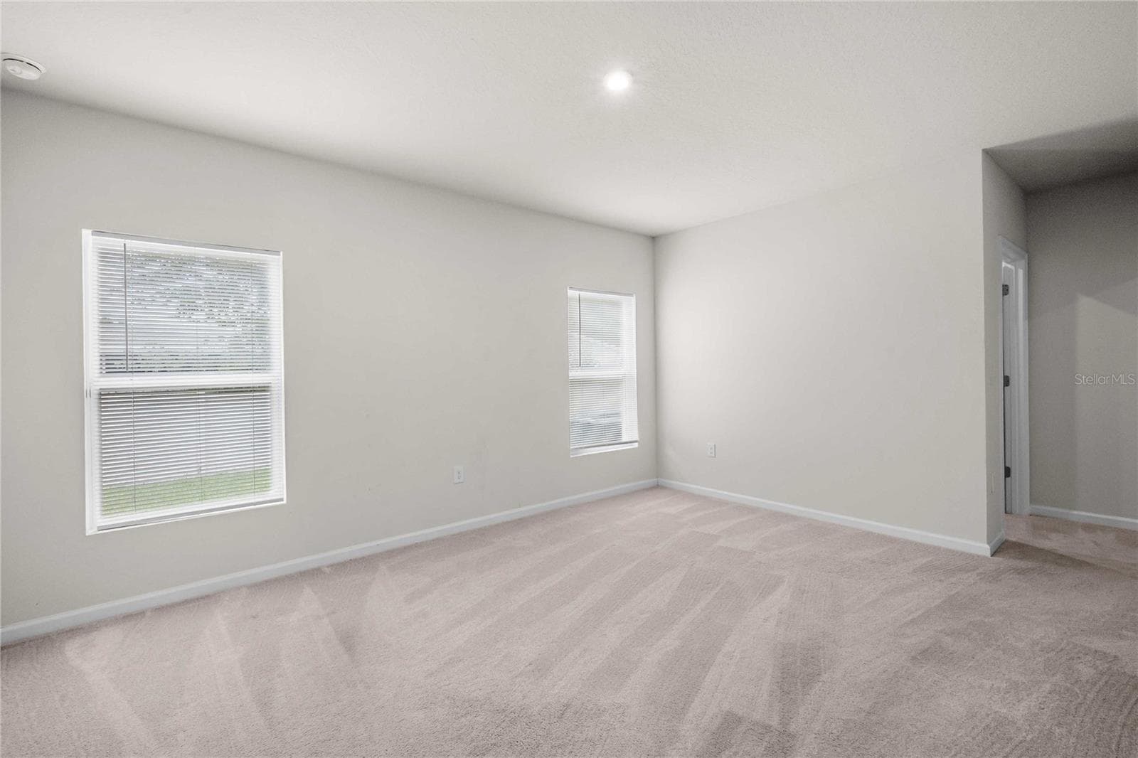 The primary has a walk in closet and ensuite bath - 35155 JOMAR AVE, ZEPHYRHILLS