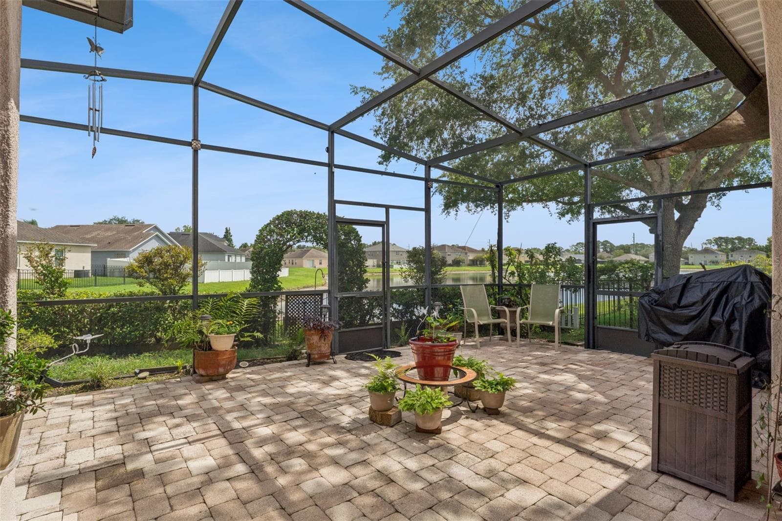 Patio View of the Community Lake - 9955 MEDALLION BLUFF LN, ORLANDO