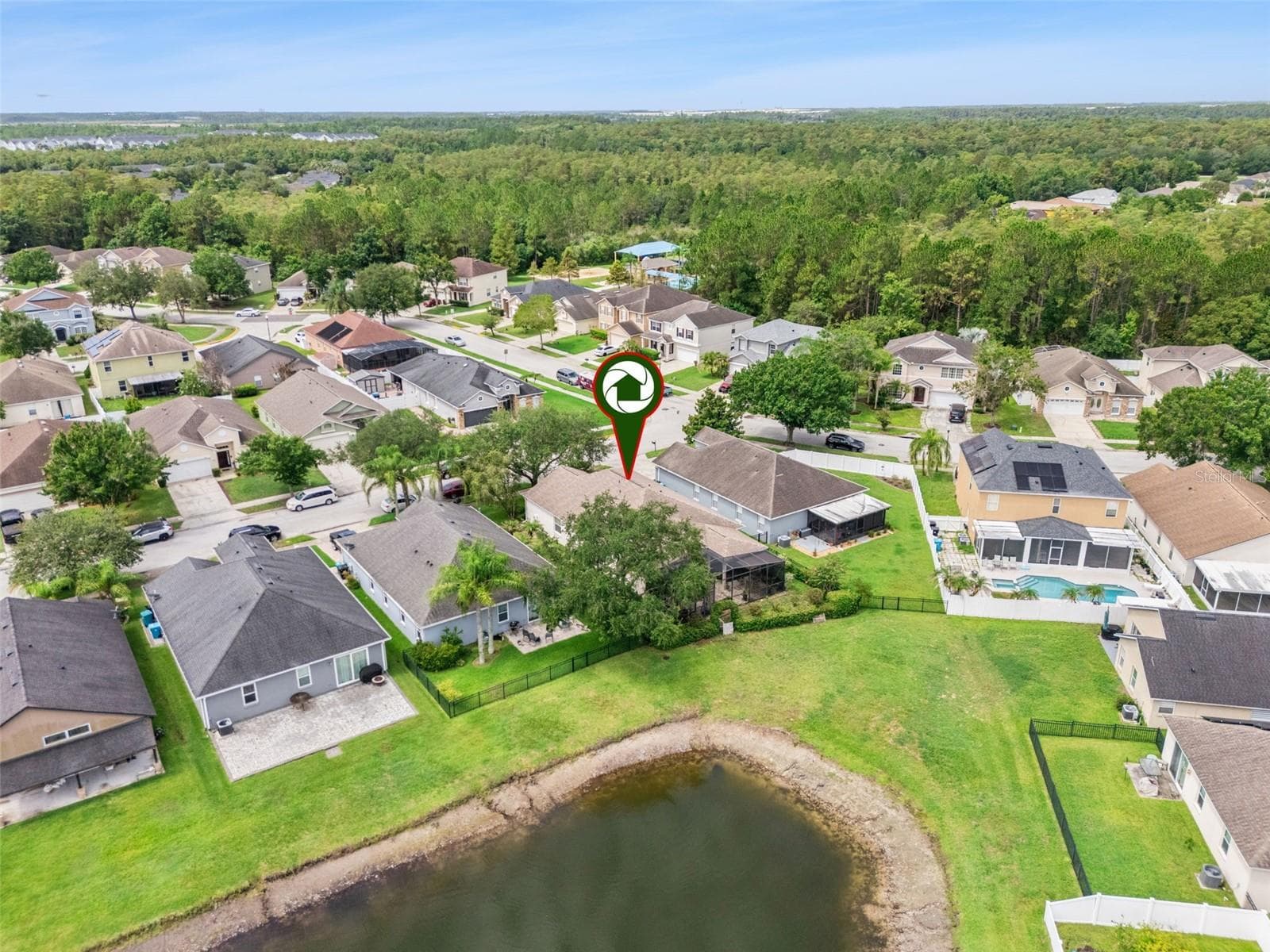 Rear aerial view & surrounding community - 9955 MEDALLION BLUFF LN, ORLANDO