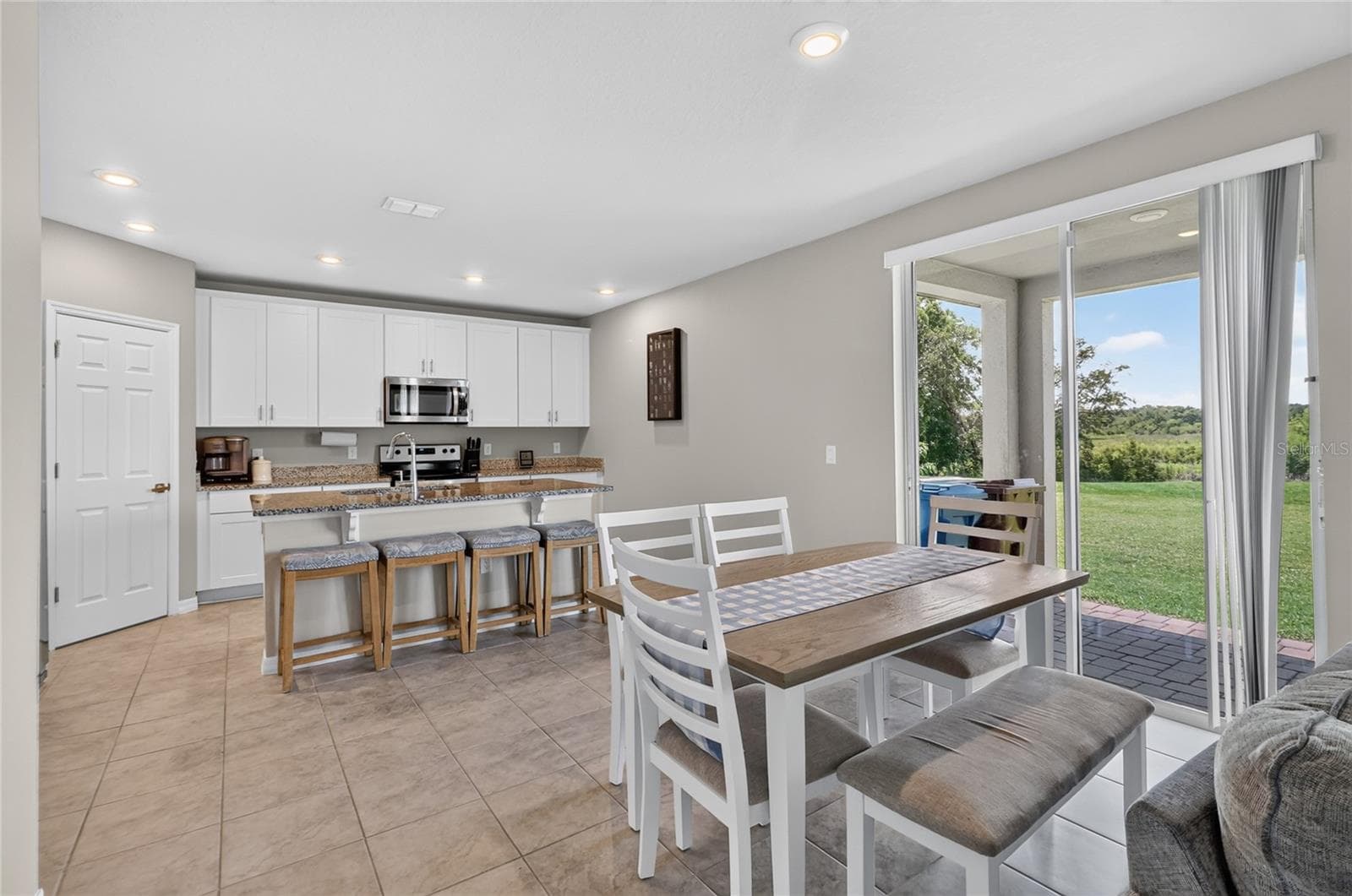 Dining room view to kitchen - 3310 WEITZEL DR, HAINES CITY