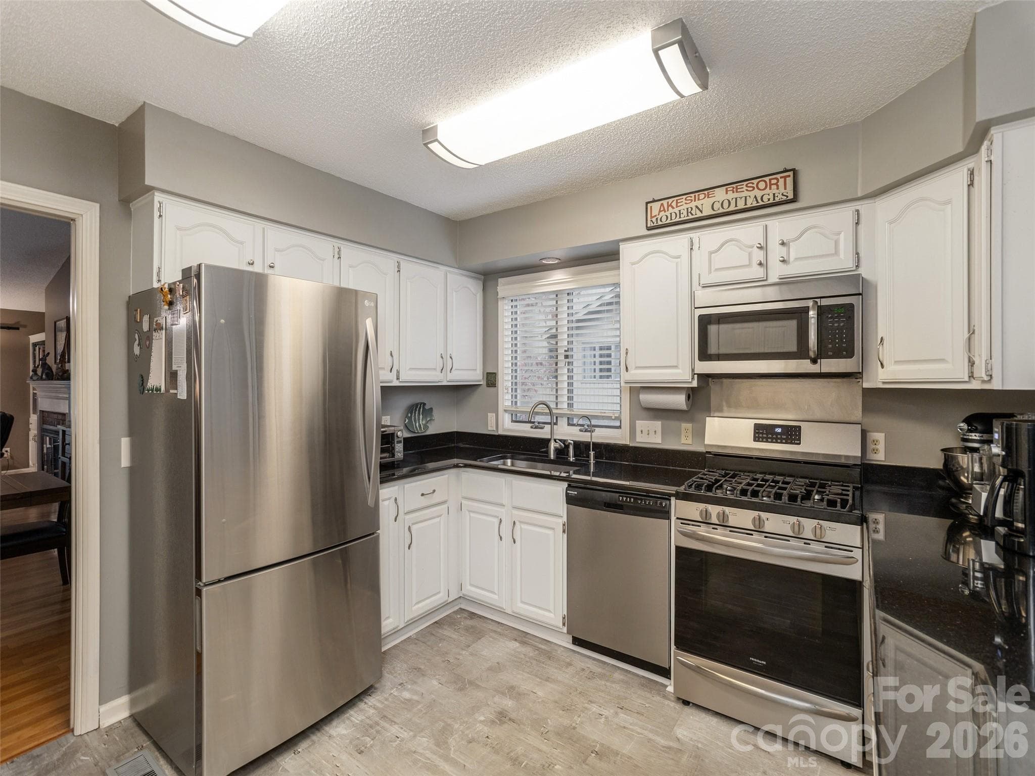 Updated kitchen with SS appliances and window over the sink - 606 Red Oak Drive, Hendersonville