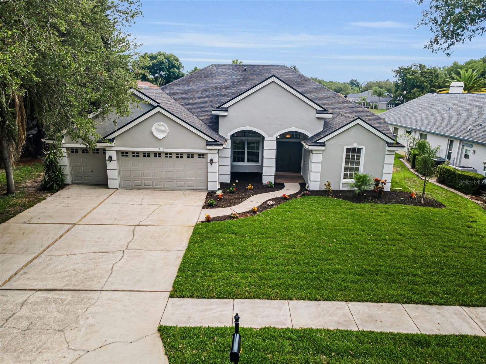 Front w/new sod - 4084 LIGUSTRUM DR, PALM HARBOR