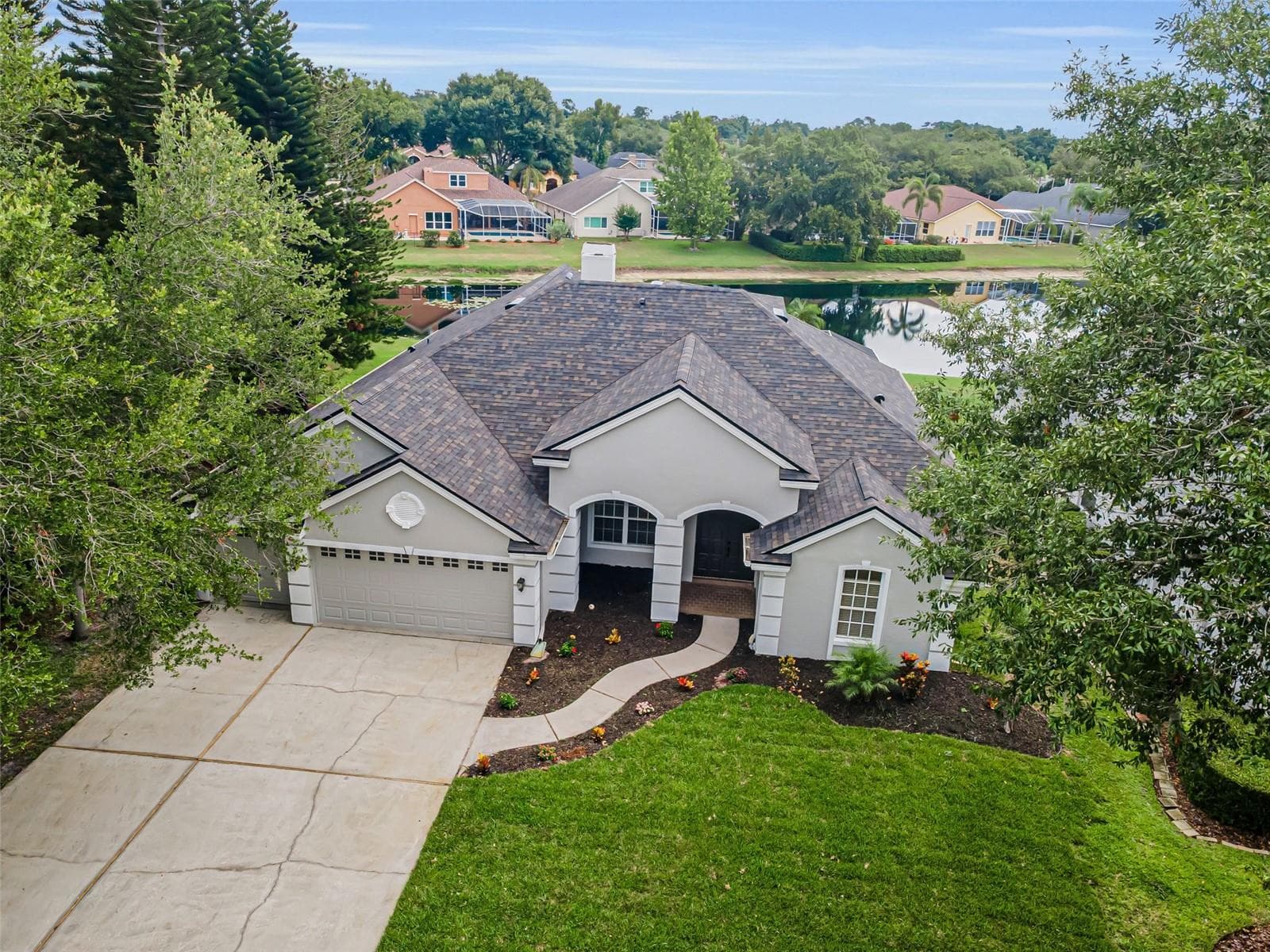 Front w/new sod - 4084 LIGUSTRUM DR, PALM HARBOR