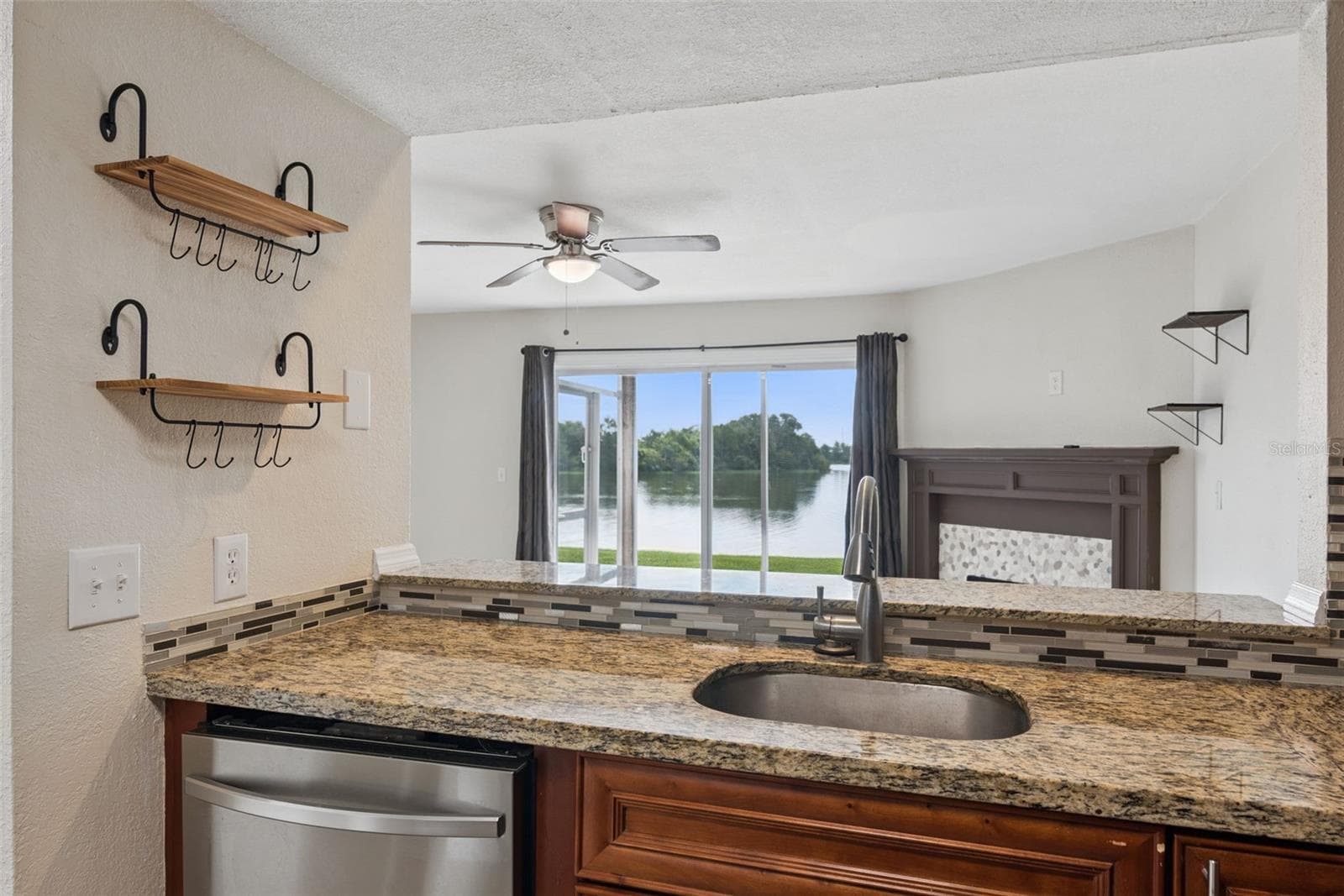 Kitchen with Granite Countertops and new Stainless Steel Appliances - 214 MAJORS LN #C, KISSIMMEE