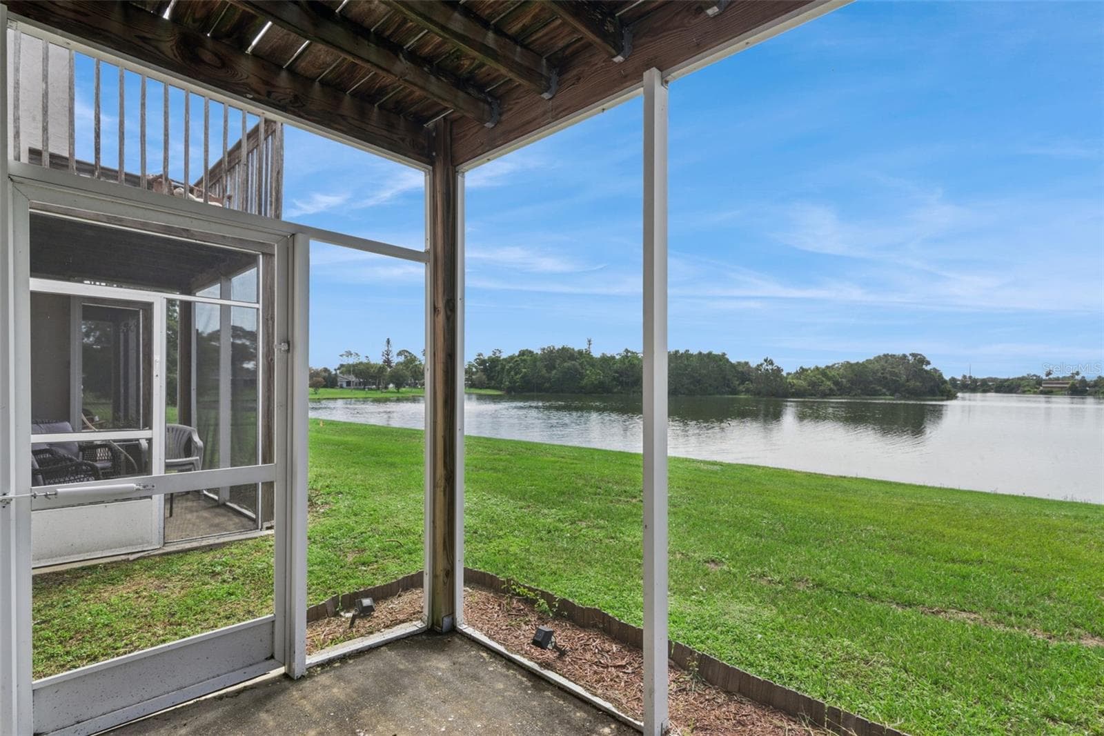First Floor Covered Patio with view to the pond - 214 MAJORS LN #C, KISSIMMEE