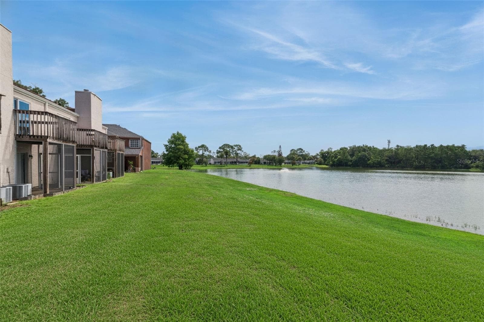 Rear view of Pond - 214 MAJORS LN #C, KISSIMMEE