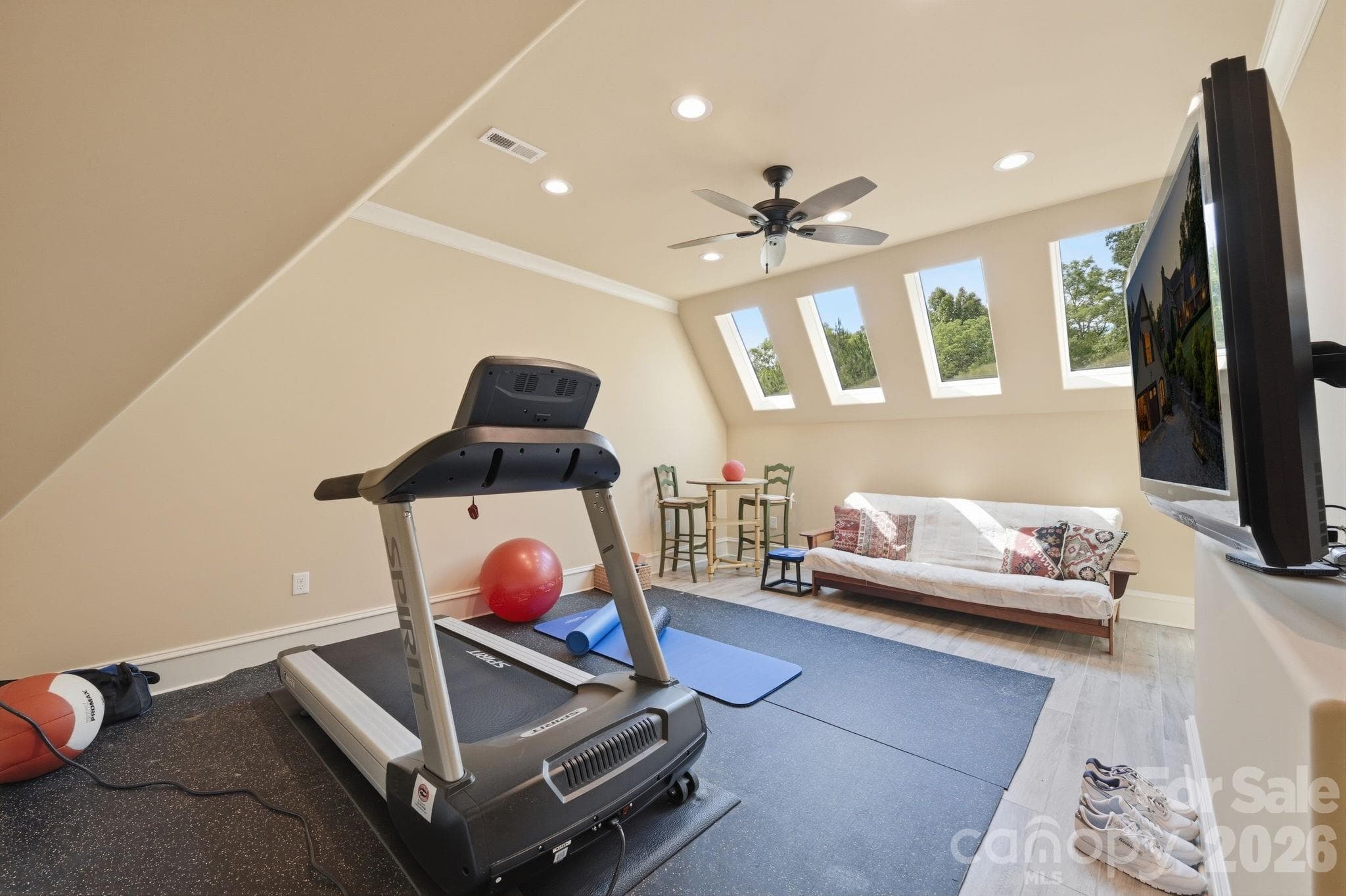 Tiled Exercise room with walk-in attic storage access - 8528 Waxhaw Creek Road, Waxhaw