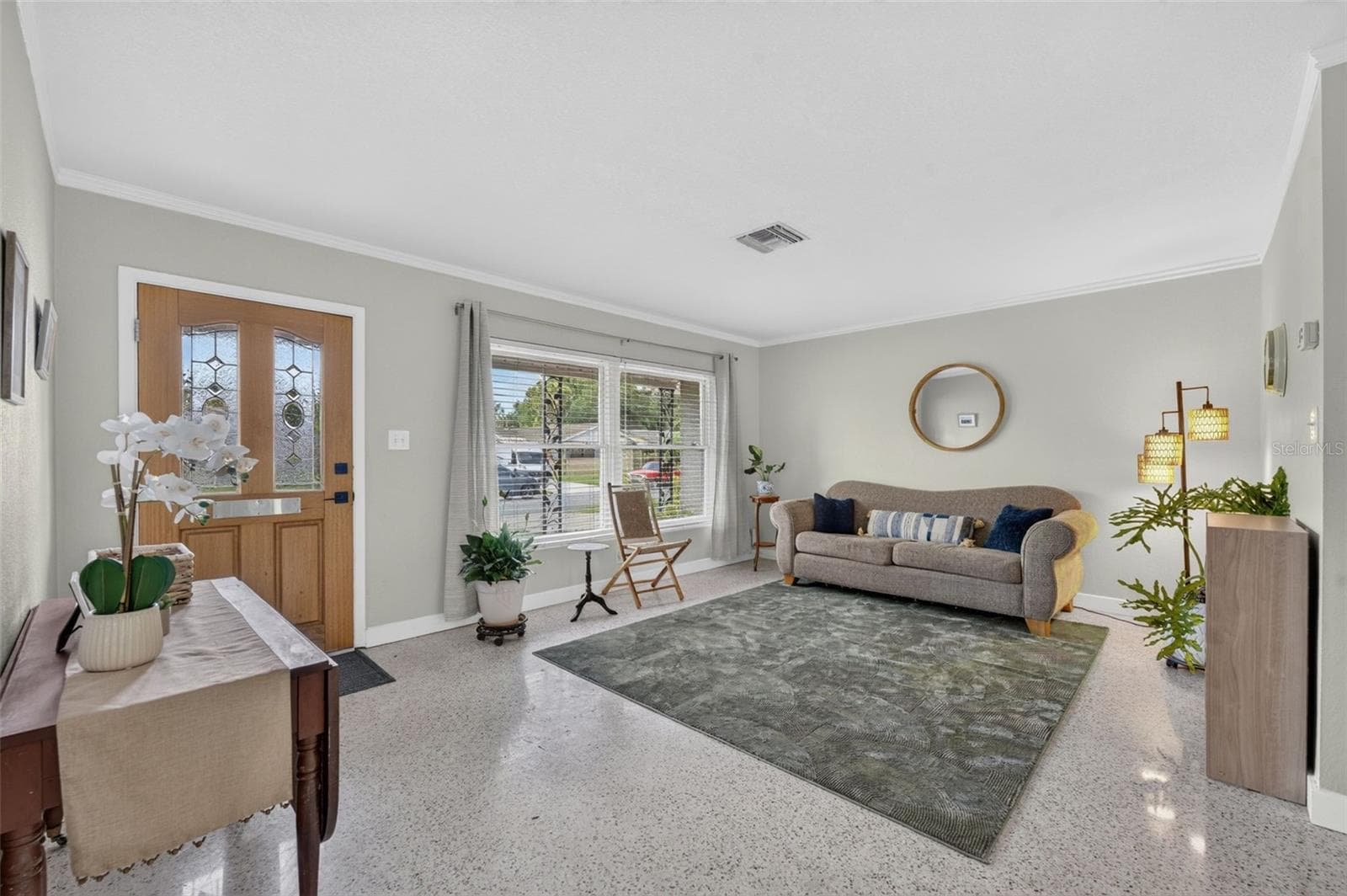 Living space with terrazzo flooring and crown molding - 619 MARSHALL ST, ALTAMONTE SPRINGS
